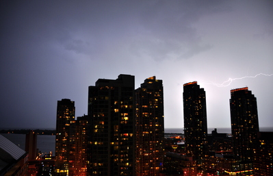 Horizontal lightning behind the building