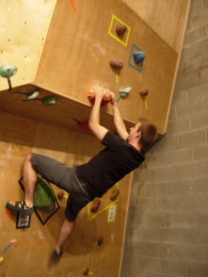 Me on the start of a bouldering problem