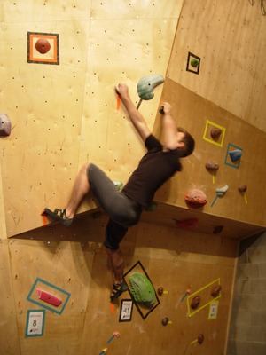 Me slightly further along on a bouldering problem