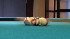 Pool balls being broken apart