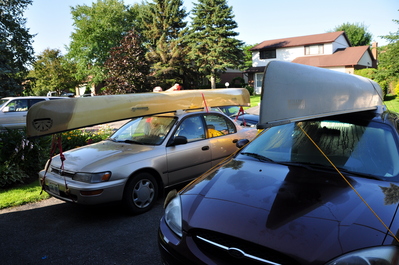 The other two cars with canoes