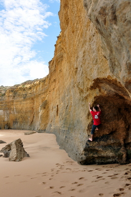 Climbing at the mouth of the cave on the beach