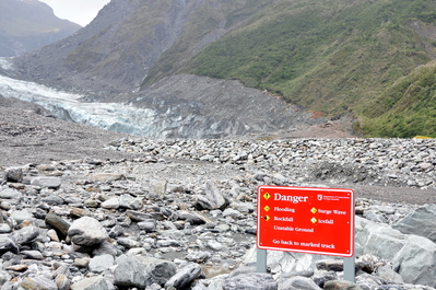 Glacier in the distance with awesome danger sign
