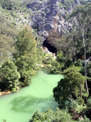 Approaching the bus entrance to the Jenolan Caves with a cool sediment filled river in the foreground