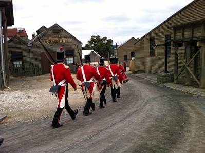 Red coats in front of the candy store