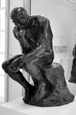 Little version of the Thinker in the museum