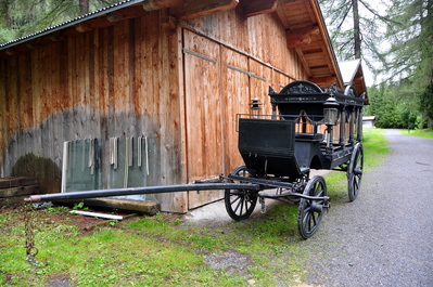 Horse-drawn hearse outside the village cemetery