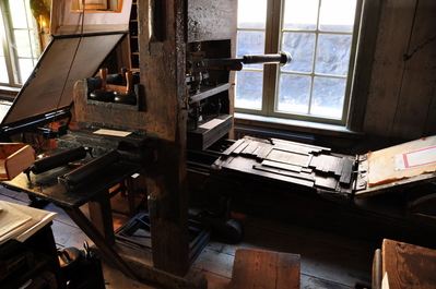 In the print shop (solid wood printing press from the 1600s)