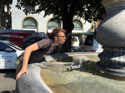 Drinking from one of many public water fountains