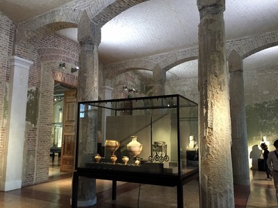 In the Neues Museum, with original columns and rebuilt walls that show the damage from the war