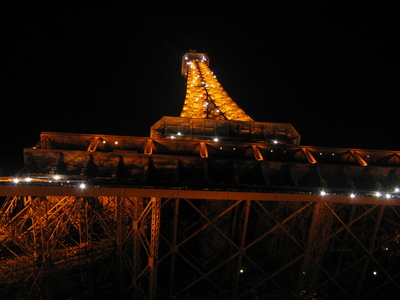 The Eiffel Tower at night from below while sparkling