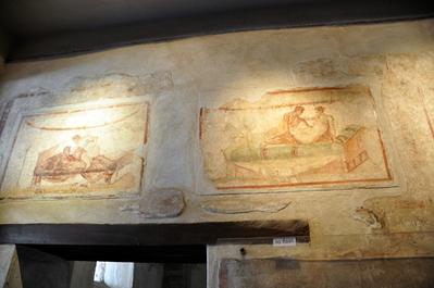 Frescos in a brothel. Each picture is above a room and depicts what service is available in that room.
