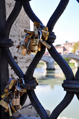 Love Locks on a bridge, couples write their name on the lock, lock it to a bridge and throw the key into the water