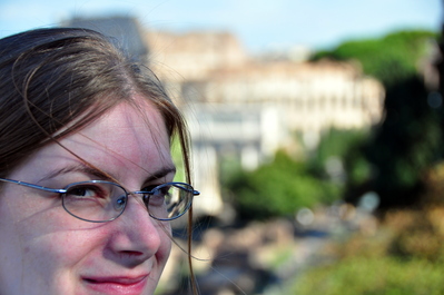 Kim with the Colosseum in the distance