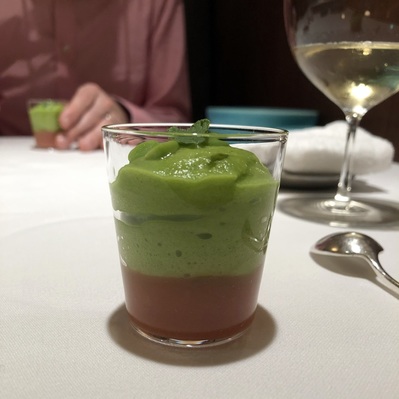 Tomato soup with goat cheese mousse and green pea foam