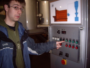 Me pressing a button at the chocolate factory