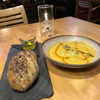 Pumpkin soup and bread at dinner